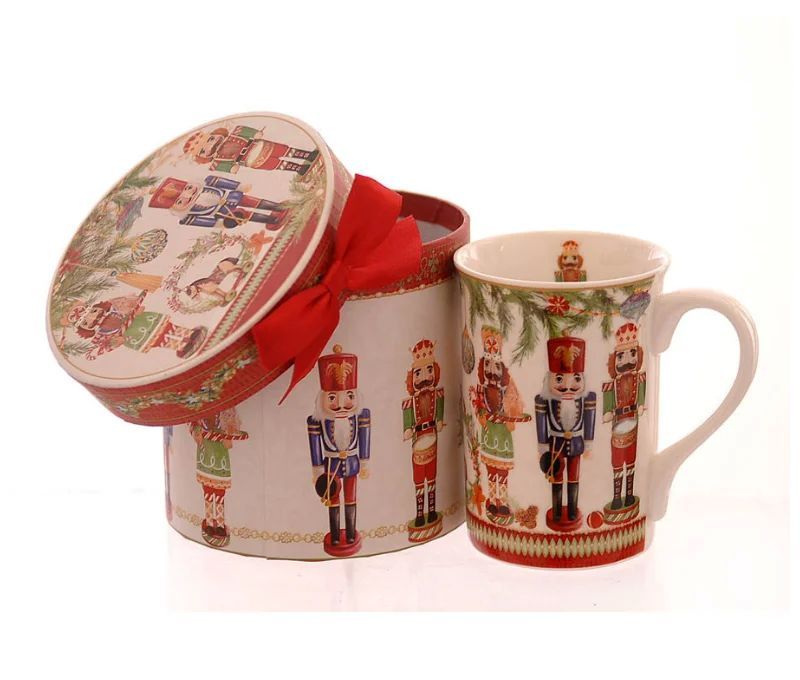 Mug porcelaine blanc motif casse-noisettes colorés guirlandes et boîte cadeau ronde assortie ruban rouge H11,5cm 320ml