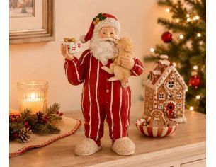 Figurine Noël résine Père Noël pyjama rayé rouge blanc tenant chiot beige et cadeau emballé pattes H30cm