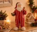 Voir la slide Figurine Noël résine Père Noël pyjama rayé rouge blanc tenant mug vert et biscuit pain d'épices chaussons moelleux H30cm