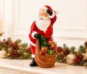 Voir la slide Figurine Père Noël en résine 38cm portant une hotte avec cadeaux, sapin et ourson