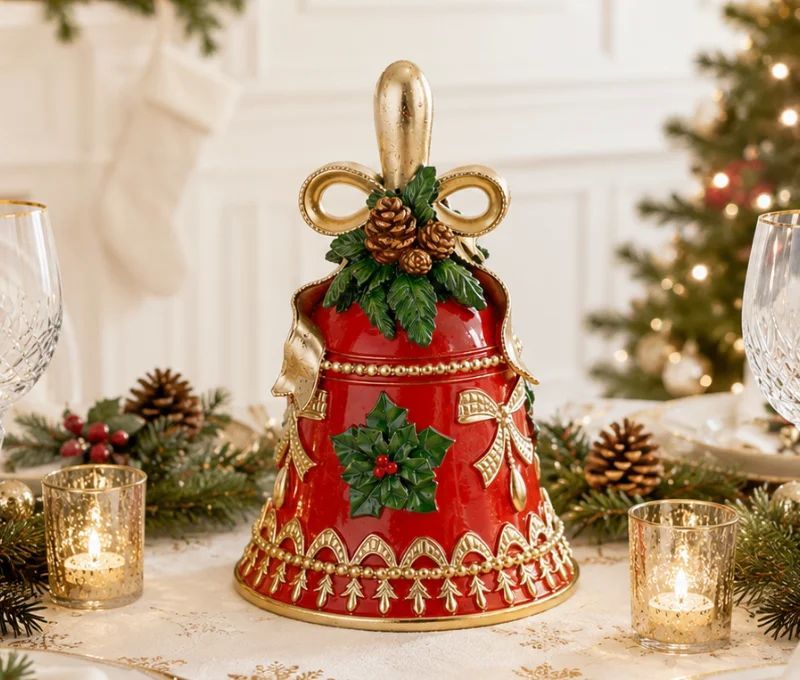 Cloche de Noël résine rouge brillante poignée dorée nœud doré pommes de pin feuilles vertes houx baies rouges motifs dorés H20cm