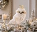 Voir la slide Hibou blanc H22cm recouvert de plumes, couronne dorée, yeux marron, bec et pattes beiges