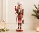 Voir la slide Figurine casse-noisette Alphonse H46cm en résine, tenue rouge rose et verte, toque, sucre d’orge, pain d’épices