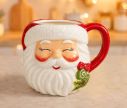 Voir la slide Mug céramique H16cm forme tête Père Noël rieur, bonnet rouge texturé, barbe blanche, anse assortie 550ml