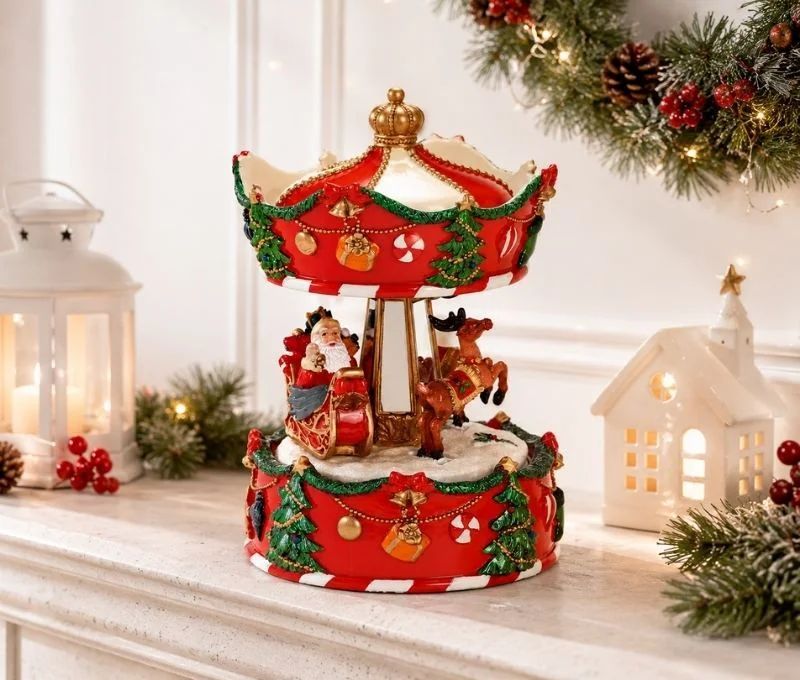 Boîte à musique carrousel Noël poly rouge Père Noël traîneau renne guirlandes sapins cloches dorées mouvement rotatif H17cm