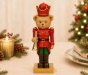 Voir la slide Figurine ourson casse-noisette poly rouge doré uniforme vert trompette dorée couronne rouge socle doré Noël H24cm
