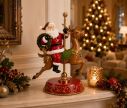 Voir la slide Décoration Père Noël sur renne carrousel socle rouge doré H46cm