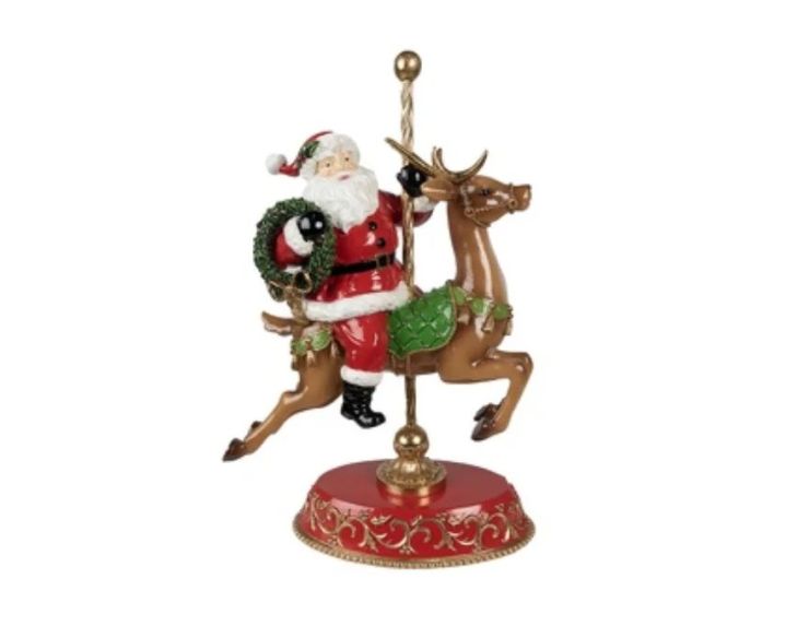 Décoration Père Noël sur renne carrousel socle rouge doré H46cm