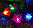 Voir la slide Guirlande lumineuse rétro 150 LED multicolores capuchons étoile bleu orange rose vert câble noir sapin de Noël
