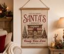 See slide Beige fabric wall hanging Santa's toy shop illustration wooden dowels jute cord L40xW2xH60cm