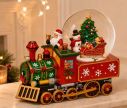Voir la slide Boîte à musique boule à neige locomotive rouge verte Père Noël bonhomme de neige sapin traîneau roues dorées L25xP14xH21cm