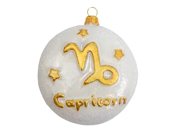 Boule de noël en verre soufflé blanche et doré avec le signe du capricorne et des étoiles. Diamètre de la boule 8cm