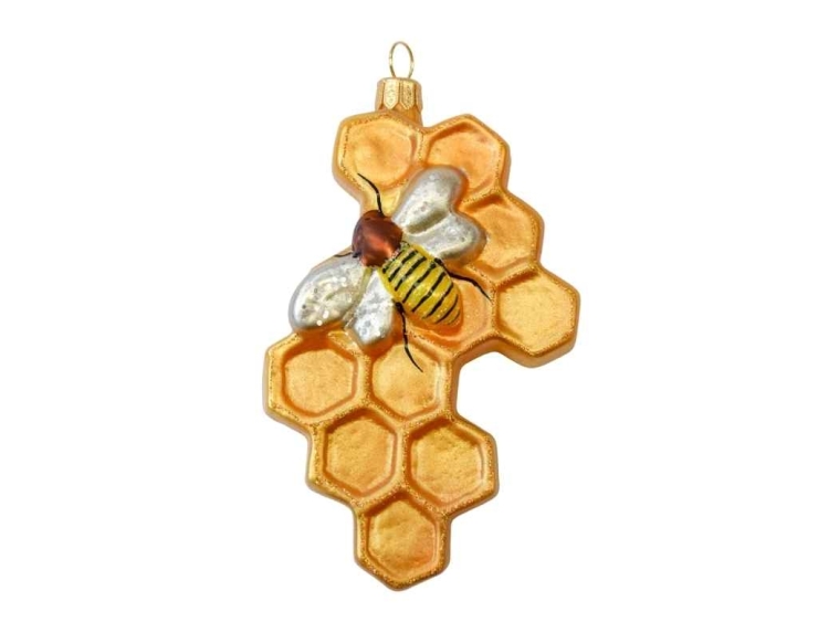 Boule de Noël originale nid d'abeille en verre soufflé avec petite abeille peinte à la main. Tons dorés. Hauteur 12cm.