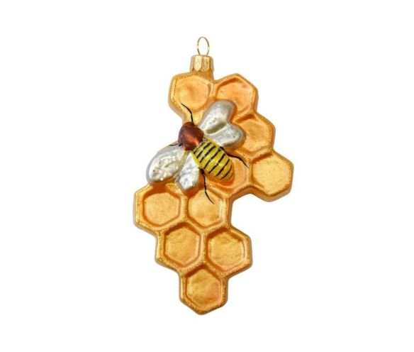 Boule de Noël originale nid d'abeille en verre soufflé avec petite abeille peinte à la main. Tons dorés. Hauteur 12cm.