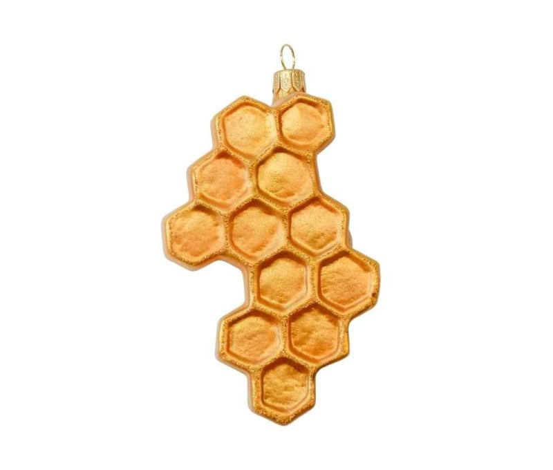 Boule de Noël originale nid d'abeille en verre soufflé avec petite abeille peinte à la main. Tons dorés. Hauteur 12cm.