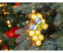 See slide Boule de Noël originale nid d'abeille en verre soufflé avec petite abeille peinte à la main. Tons dorés. Hauteur 12cm.