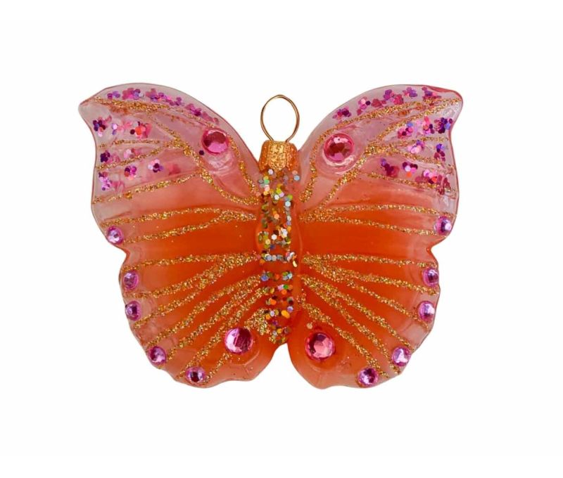Boule de Noël papillon rose et orange en verre soufflé, strass et paillettes roses. Hauteur de 6cm, made in Europe.