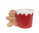 See slide Mug de Noël rouge avec bonbons et anse en forme de pain d'épice.