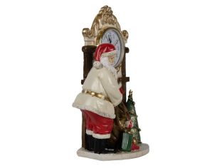 Horloge décorative avec Père Noël et sac de cadeaux.

Hauteur : 22cm