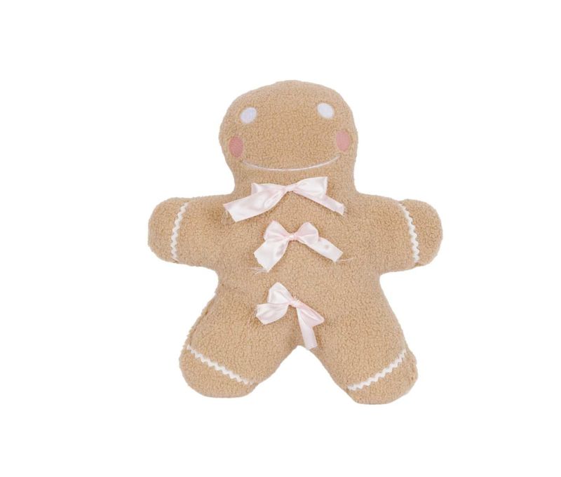 Coussin de Noël pain d’épice beige et noeuds rose.