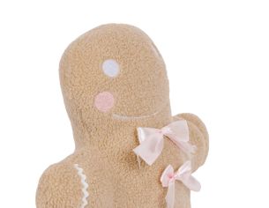 Coussin de Noël pain d’épice beige et noeuds rose.