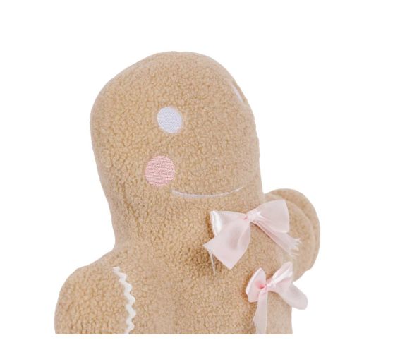 Coussin de Noël pain d’épice beige et noeuds rose.