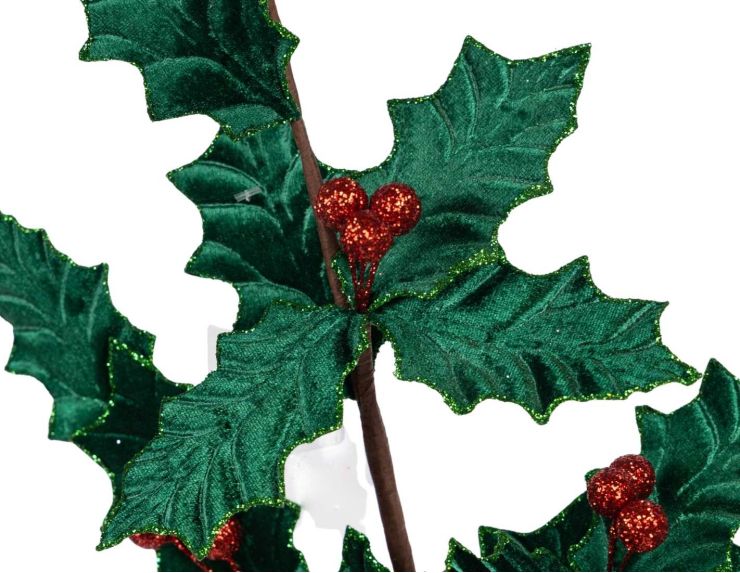 Branche de houx décorative de 80 cm aux feuilles vertes en velours et aux baies rouges scintillantes.
