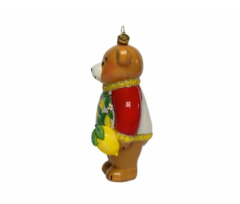Suspension de Noël en verre soufflé représentant un ourson italien avec finition luxe façon porcelaine. Hauteur : 18 cm.