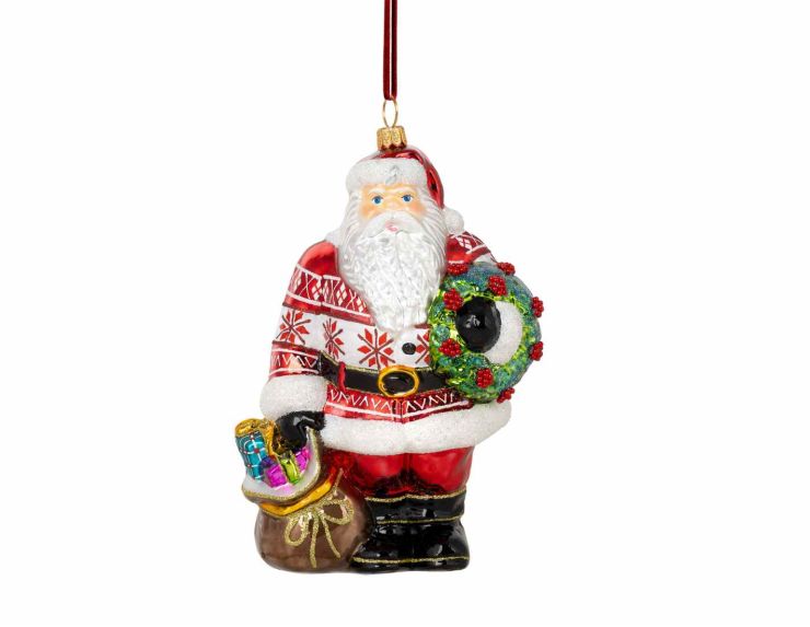 Suspension de Noël en verre soufflé représentant un Père Noël avec couronne et hotte. Hauteur : 18 cm. Peint à la main.
