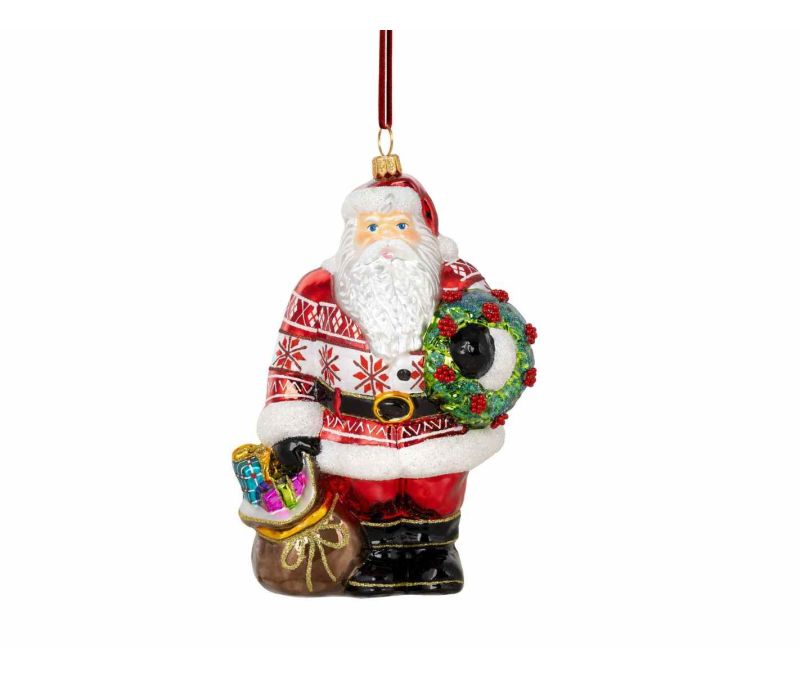 Suspension de Noël en verre soufflé représentant un Père Noël avec couronne et hotte. Hauteur : 18 cm. Peint à la main.