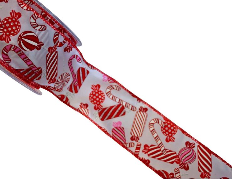 Ruban blanc décoré de bonbons rouges et roses pailletés. Largeur 7cm, longueur 9m