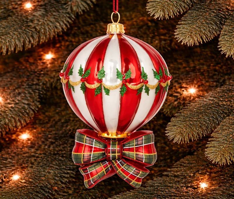 Suspension de Noël montgolfière rouge blanche avec un noeud tartan en verre soufflé décorée main. Hauteur 15cm.