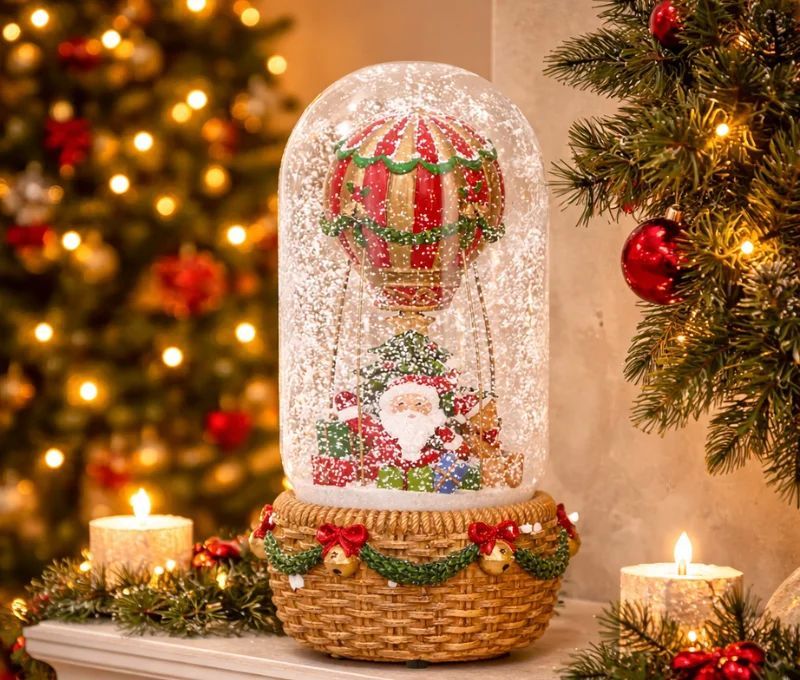 Boule à neige musicale Père Noël montgolfière rouge vert socle osier grelots H23cm - Lilosquare